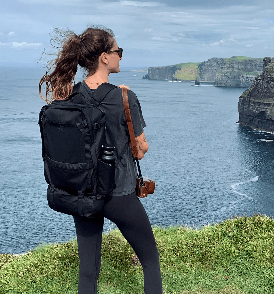 back view of backpack against the Cliffs of Moher