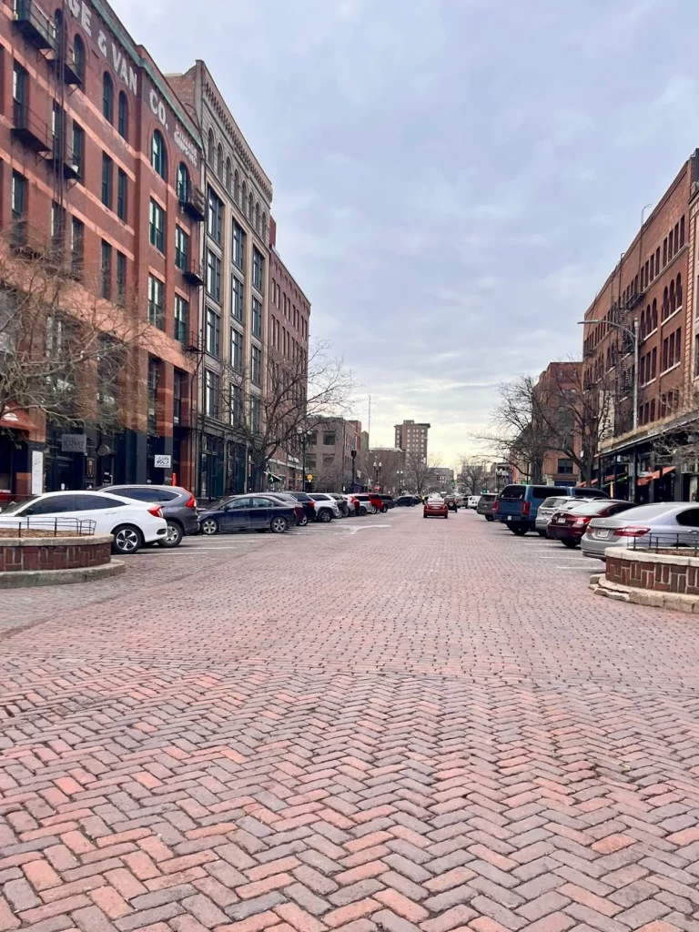 Long brick street with brick buildings lining both sides