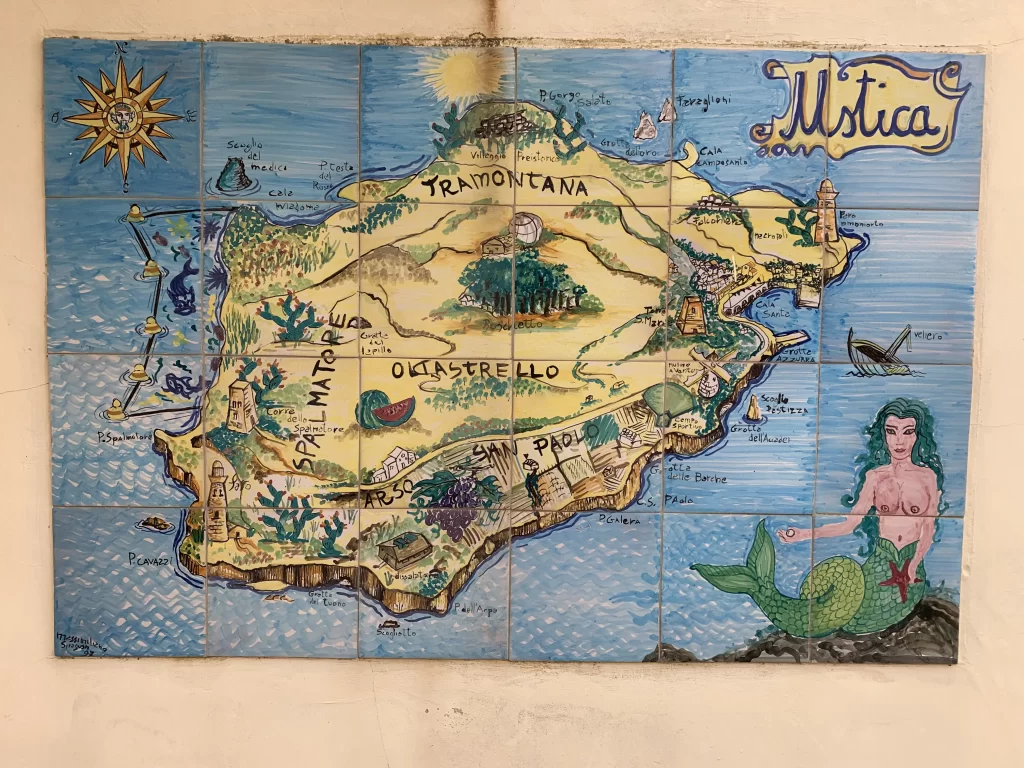 A yellow mural map of an island on a blue background