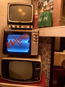 stack of old tv's with MALEVO written across the middle TV